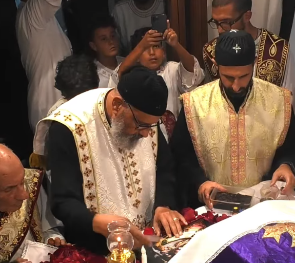 Deacons and clergy at the altar during the Golgotha hymn